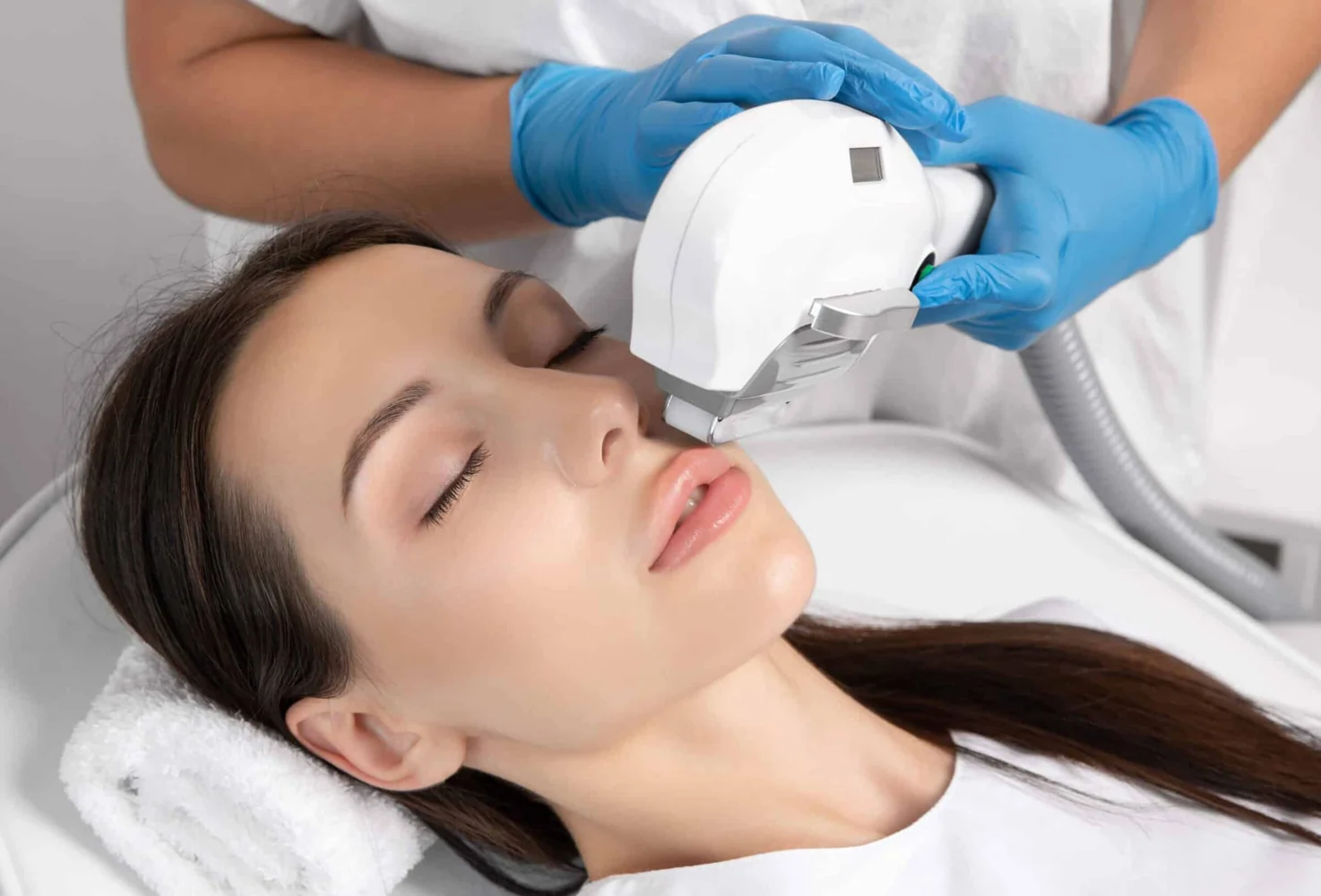 Woman receiving IPL photofacial treatment for radiant, youthful skin at Viva Vitality in Lakeland, FL