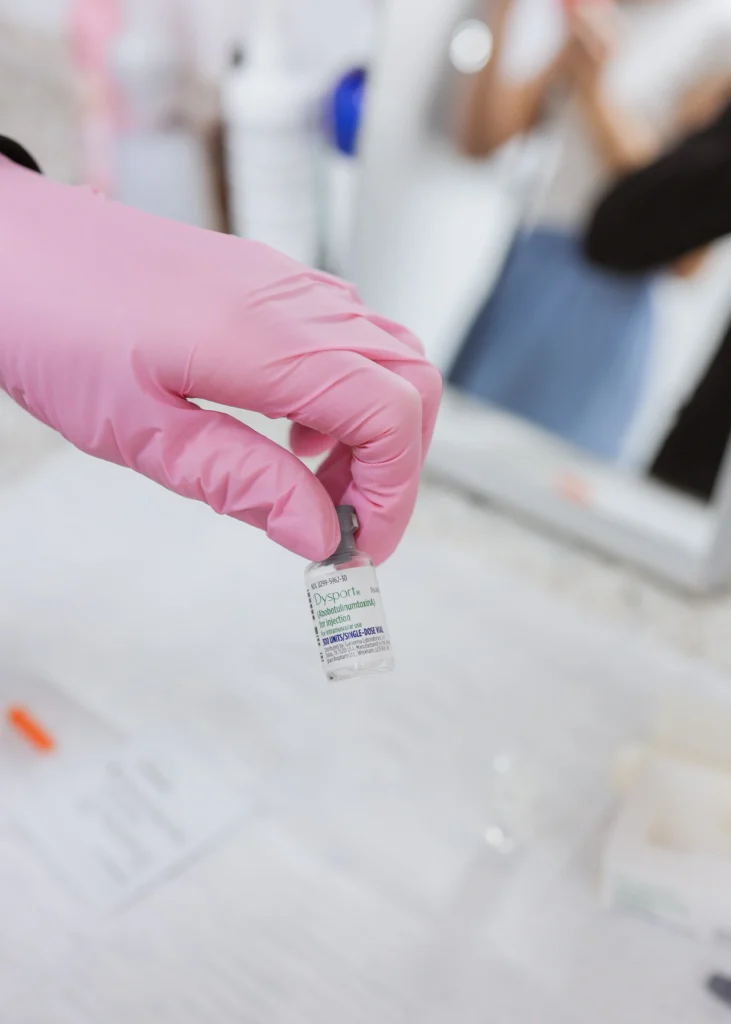 Gloved hand holding a vial of Dysport at Viva Vitality MedSpa in Lakeland, Florida