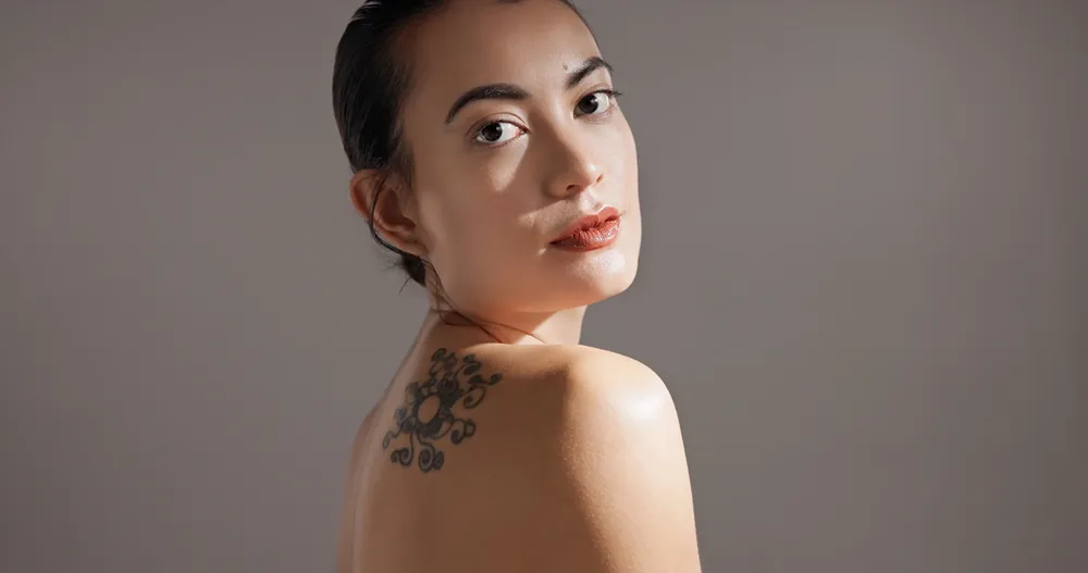 Woman with tattoo on back